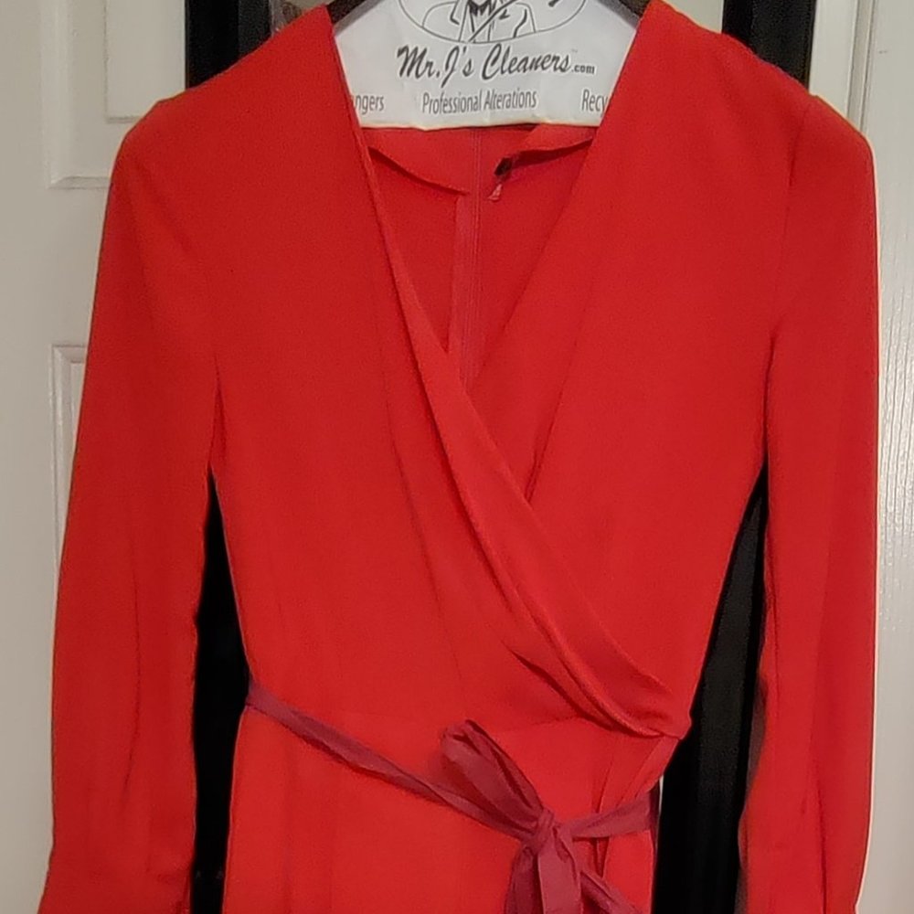 Red long sleeve  v neck jumpsuit.